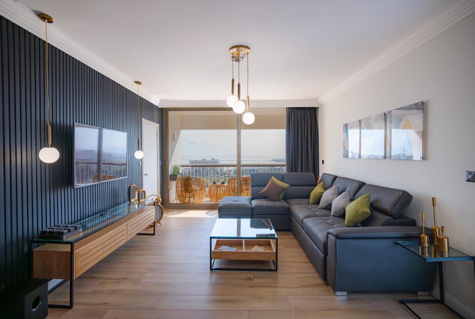David Dead Sea Resort & Spa เอนโบเกก ภายนอก รูปภาพ A living room in a modern apartment